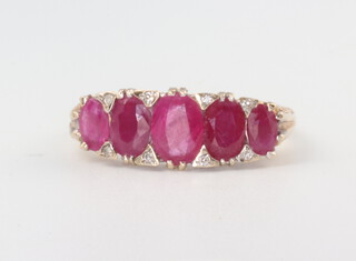 A 9ct yellow gold  ruby and diamond chip ring, 3.4 grams, size Q