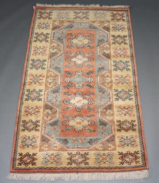 A yellow and blue ground Caucasian style rug with 5 diamonds to the centre 201cm x 125cm 