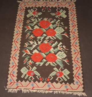 A brown, green and orange ground Kilim rug with geometric designs 332cm x 237cm 