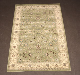 A green and white ground Persian style machine made rug 235cm x 160cm 