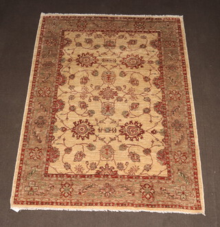 A Caucasian style cream and brown ground floral patterned rug 253cm x 194cm 
