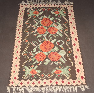 A black, orange and green ground Kilim rug with overall geometric designs 357cm x 246cm 