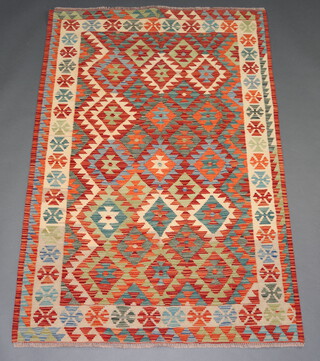 A yellow, green and blue ground Chobi Kilim runner with all over geometric designs 184cm  x 124cm 