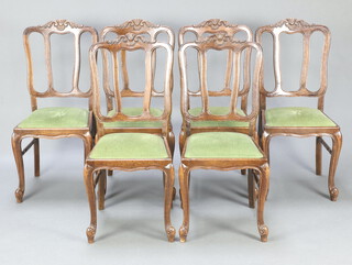 A set of 6 French oak tulip back dining chairs with upholstered drop in seats, raised on cabriole supports 97cm h x 43cm w x 41cm d (seats 24cm x 25cm) 
