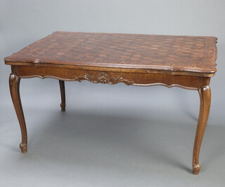A French parquetry oak draw leaf dining table, raised on cabriole supports 79cm h x 145cm w x 99cm d 