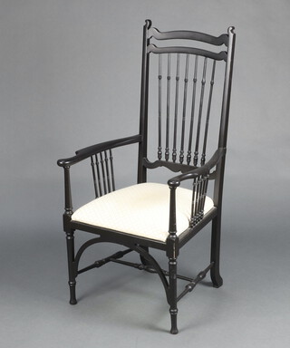 A Sussex style ebonised stick and rail back chair in the William Morris manner, with upholstered seat, raised on turned supports 112cm h x 57cm w x 52cm d (seat 25cm x 33cm)  
