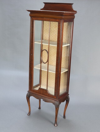 An Edwardian mahogany display cabinet with raised back, the shelved interior enclosed by a astragal glazed panelled door, raised on a shaped base with cabriole supports 184cm h x 65cm w x 35cm d 