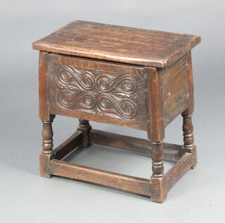 An Ipswich style carved oak stool/box with hinged lid, raised on turned and block supports 51cm x 51cm x 38cm 