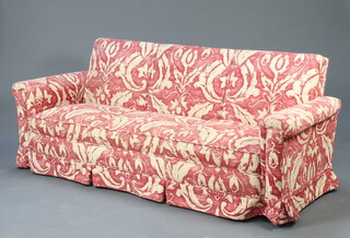 A three seat settee upholstered in gold and red coloured material 74cm h x 187cm w x 73cm d (seat 154cm x 56cm d) 
