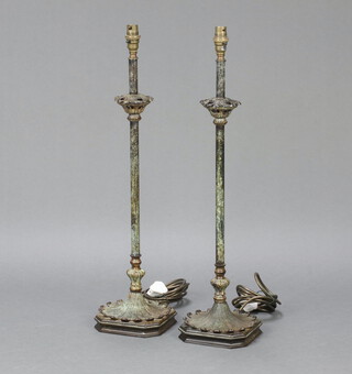 A pair of Regency style bronze table lamps with leaf decoration, raised on shaped bases 66cm h x 15cm w x 15cm d  