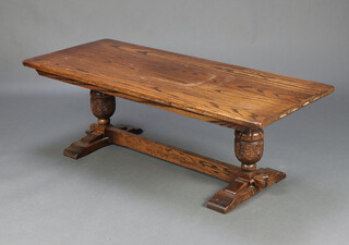 Webber, a rectangular oak refectory style coffee table, raised on cup and cover supports with H framed stretcher 46cm h x 137cm w x 55cm d (some water marks to the top)