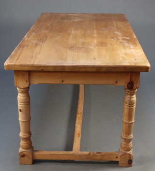 A Victorian style pine refectory dining table, raised on turned supports with H framed stretcher 78cm h x 182cm l x 90cm w (some contact marks)