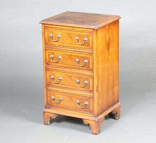 A Georgian style crossbanded yew chest of 4 drawers with brass swan neck drop handles, raised on bracket feet 72cm h x 43cm w x 35cm d (water and ring marks) 