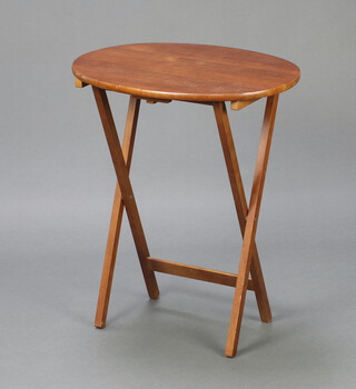An oval beech framed folding coaching table 69cm x 59cm x 43cm 