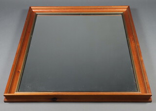 A rectangular plate wall mirror contained in a pine cushion shaped frame 107cm h x 136cm 