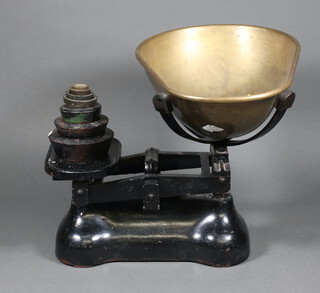 A pair of iron pan scales with brass pan, 2 Avery weights and 4 brass weights 