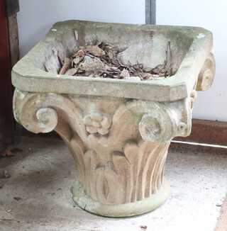 A well weathered concrete garden planter in the form of a Corinthian capital 48cm h x 48cm x 48cm