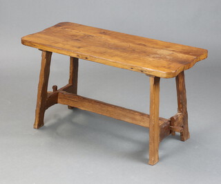 A rustic rectangular elm refectory style coffee table raised on standard end supports with H framed stretcher 48cm h x 89cm l x 39cm w (split to top and ring marks) 