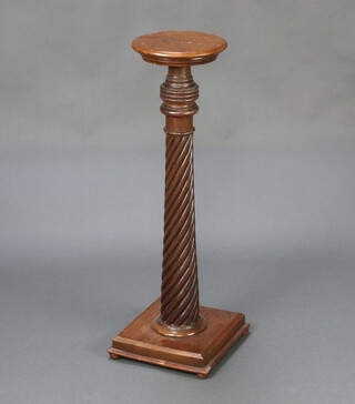A mahogany bed post torchere with square base 86cm h x 30cm 