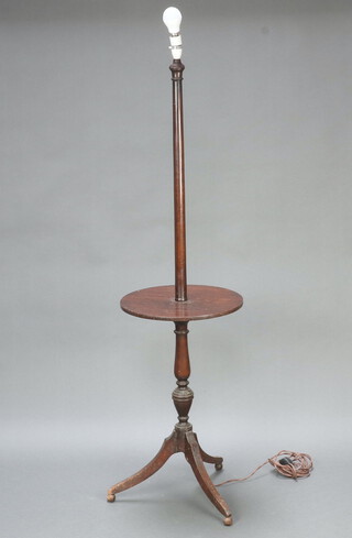A turned beech standard lamp, the base incorporating a wine table, raised on pillar and tripod base 147cm h x 39cm (Contact marks in places)