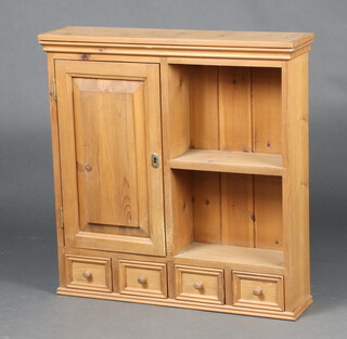 An oak hanging cabinet enclosed by a panelled door flanked by a shelf, above 4 short drawers 69cm h x 66cm w x 16cm d 