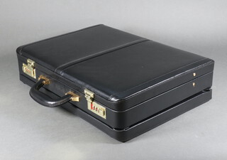 A Custom black leather combination lock briefcase
