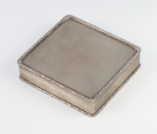 A silver engine turned square trinket box with floral rim, London 1975, maker Asprey & Co, 9cm, 216 grams