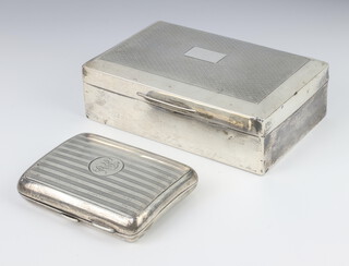 An Edwardian silver cigarette case Birmingham 1910 together with an engined turned rectangular silver cigarette box, 13.5cm Birmingham 1926 