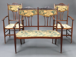 An Edwardian pierced beech framed drawing room suite comprising double chair back settee on square tapered supports 100cm h x 110cm w x 52cm d and pair of matching armchairs 108cm h x 54cm w x 50cm d 