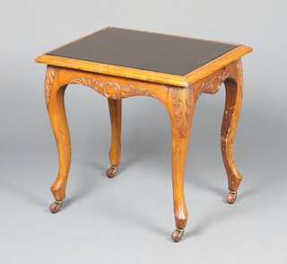 A Victorian rectangular carved oak occasional table with inset mirror panelled top, raised on cabriole supports and ceramic casters 52cm h x 55cm w x 43cm d 