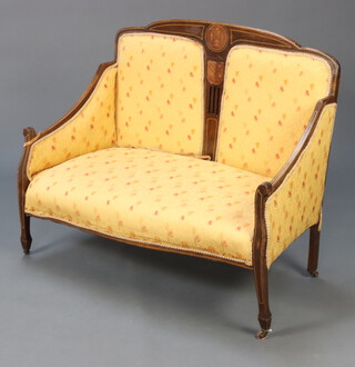 An Edwardian Art Nouveau inlaid mahogany show frame 2 seat sofa upholstered in yellow floral material, raised on square supports 99cm h x 116cm w x 56cm d 