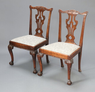 A near pair of 19th Century mahogany Chippendale style slat back dining chairs with upholstered drop in seats, raised on cabriole supports 95cm h x 53cm w x 43cm d 
