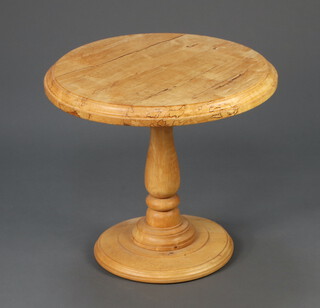 A Victorian style bleached hardwood circular pedestal occasional table raised on a  turned baluster column 55cm h x 60cm diam. 