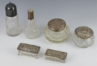 Two circular cut glass dressing table jars with silver lids (one with hole to lid), 2 rectangular ditto, scent bottle with silver collar and a sugar caster with plated collar  


