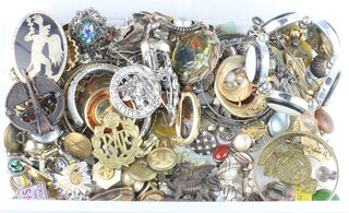 A collection of costume jewellery, brooches, badges etc 