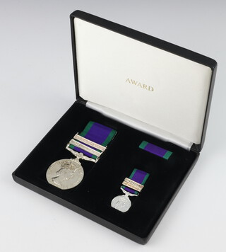 A replica General Service medal 1962-2007 with 2 bars Malay Peninsular and Dhofar to X4263447 SAC L.R.H Nunn RAF, in a presentation case with miniature and medal ribbon 