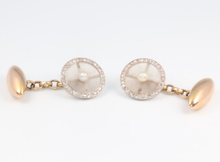 A pair of Edwardian yellow and white metal cufflinks with rock crystal, seed pearl and diamond terminals, gross weight 6.5 grams 