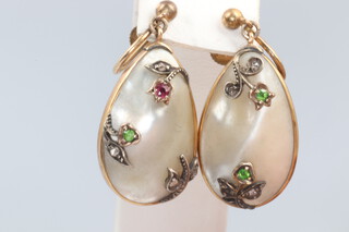 A pair of yellow metal set baroque pearl drop earrings with diamond, emerald and ruby set decoration, with screw backs 9.1 grams 23mm drop, matching lots 165 & 167