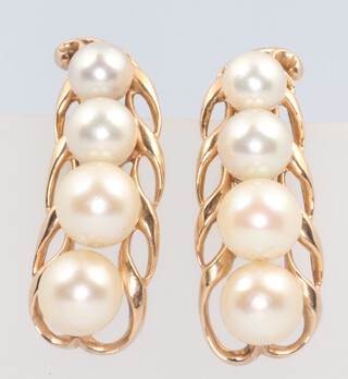 A pair of yellow gold 14k pearl ear clips, 9.3 grams, 13mm 