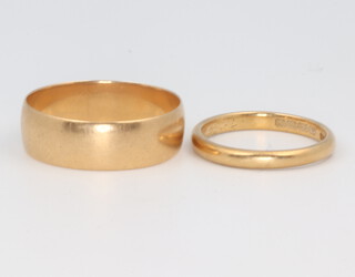Two 18ct yellow gold wedding bands size N 1/2 and X, 8.6 grams 