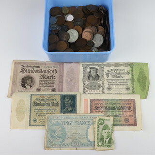A collection of various coinage and bank notes