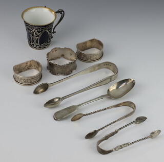 A pair of Victorian silver sugar nips London 1865, 3 napkin rings and minor cutlery 144 grams