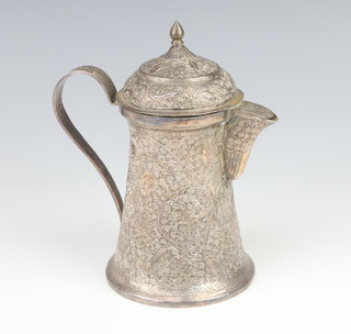 A Persian white metal coffee jug decorated with scrolling flowers 18cm, 292 grams 