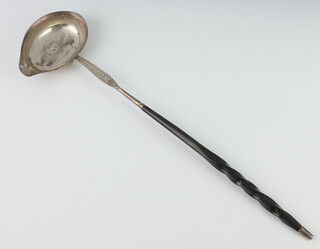 A William IV silver ladle with engraved stem and whale bone handle, London 1834 