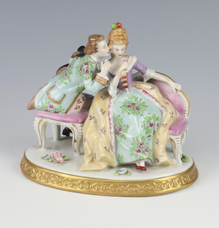 A Sitzendorf group of a lady and gentleman raised on a gilt base 13cm 