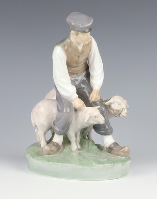 A Royal Copenhagen figure of a shepherd with 2 sheep no.627 21cm 