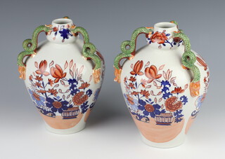 A pair of Masons ironstone ovoid vases with serpent handles decorated with flowers 21cm 