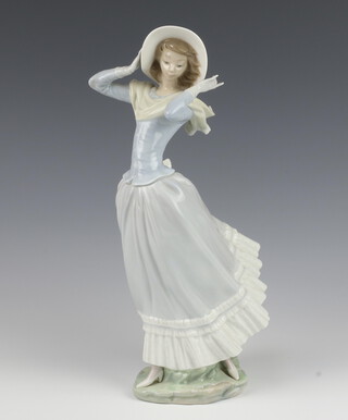 A Lladro figure of a standing lady 35cm 