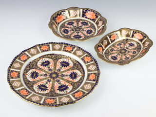 A Royal Crown Derby Imari pattern plate 1126 22.5cm, a ditto oval dish 17cm 1128 and a circular dish 18cm 1128 