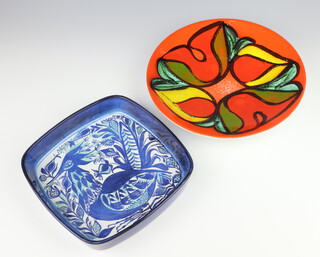 A stylish mid Century Danish square dish decorated with an exotic bird 23cm, together with a Poole shallow bowl the orange ground with flower heads 26cm 